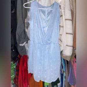 low cut BaeVely Periwinkle Romper with pom-poms